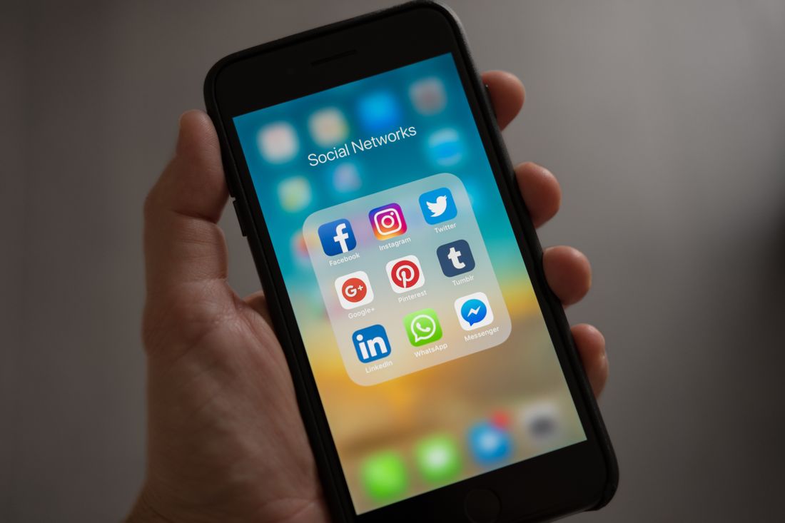 Mobile app development for iOS and Android — illustrative stock photography